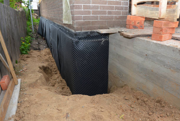 Happy homeowners after waterproofing job in Clarkrange